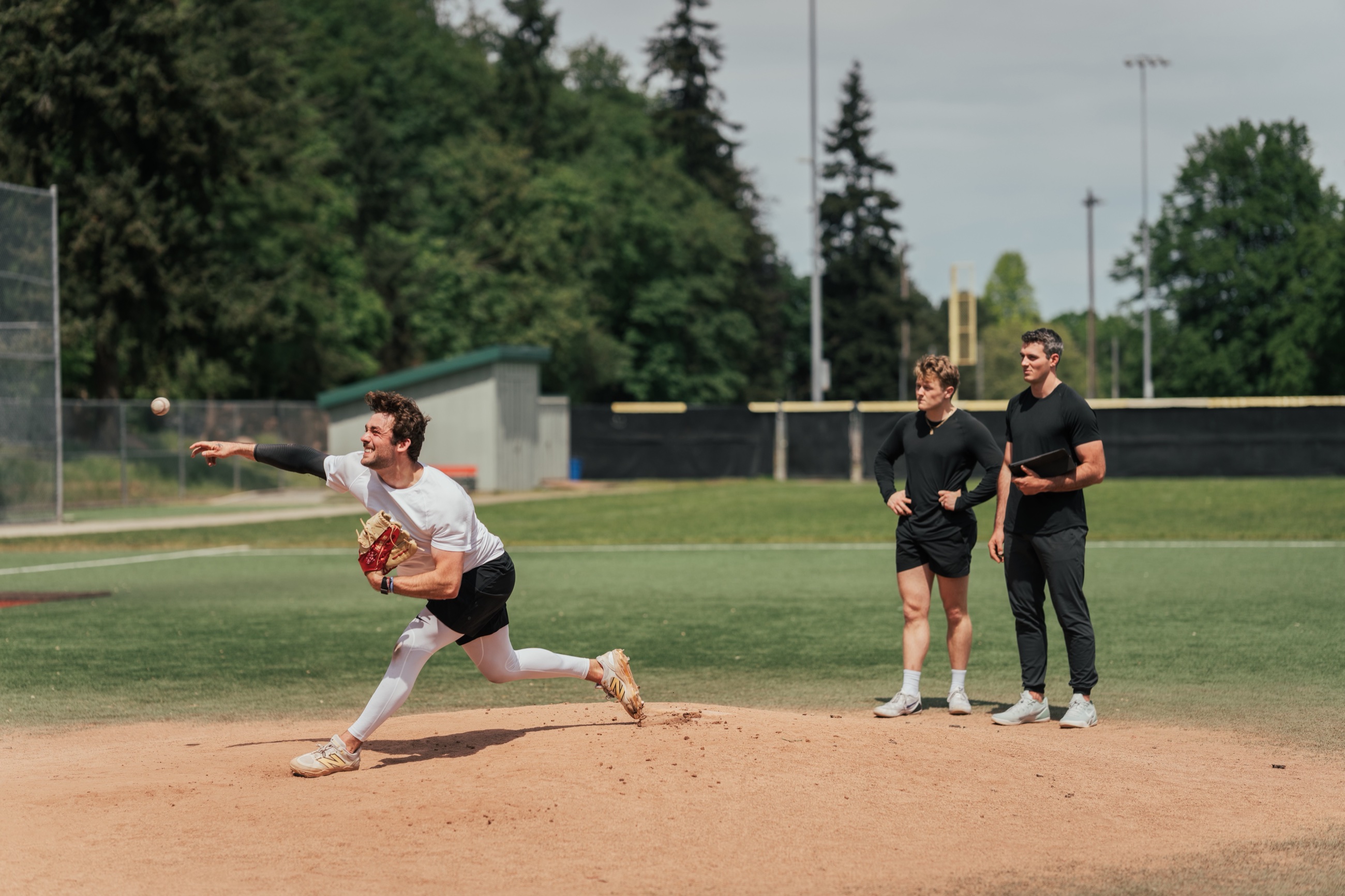 Rubicon coach observing an athlete throwing on a baseball field
