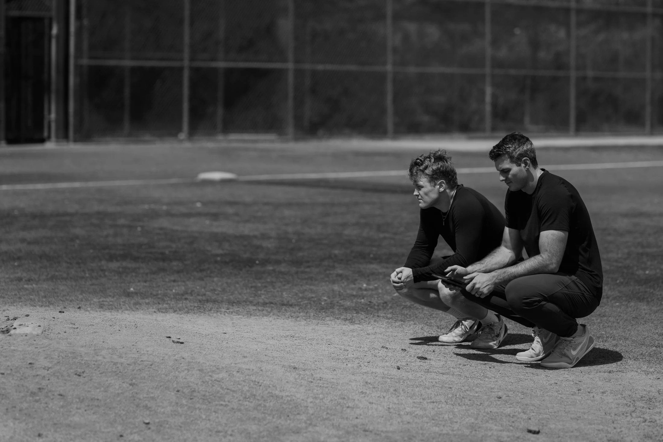 Two Rubicon coaches observing a baseball field