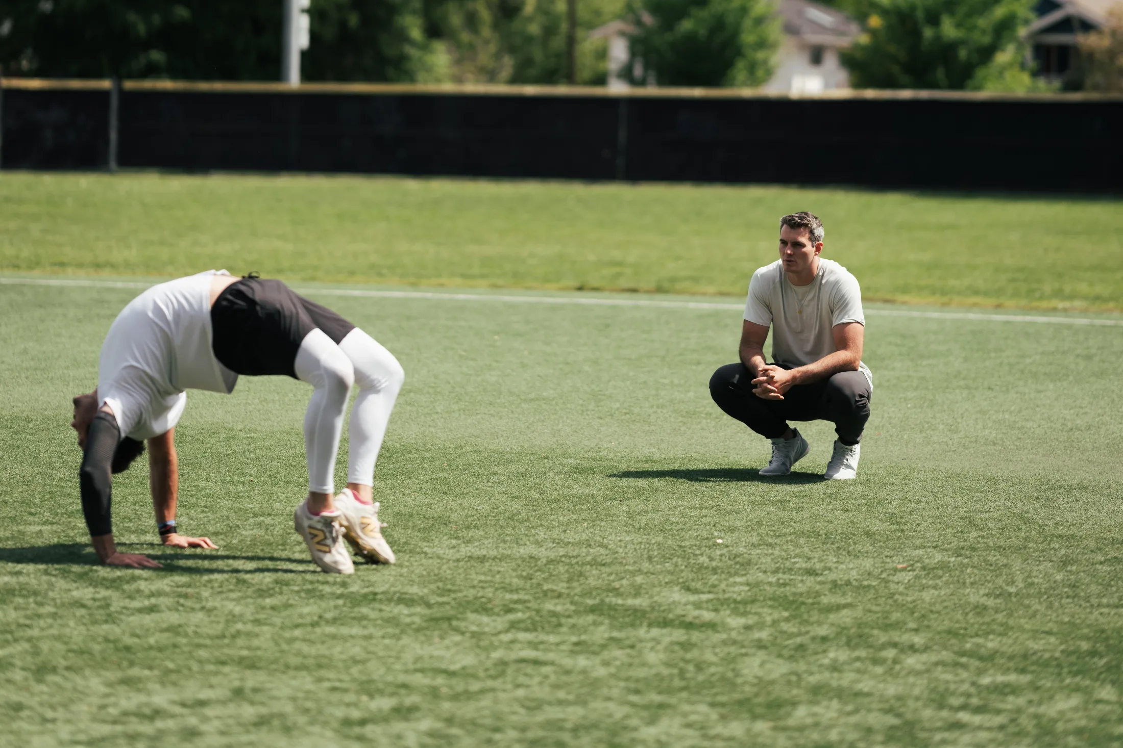 Rubicon coach watching an athlete move on a baseball field