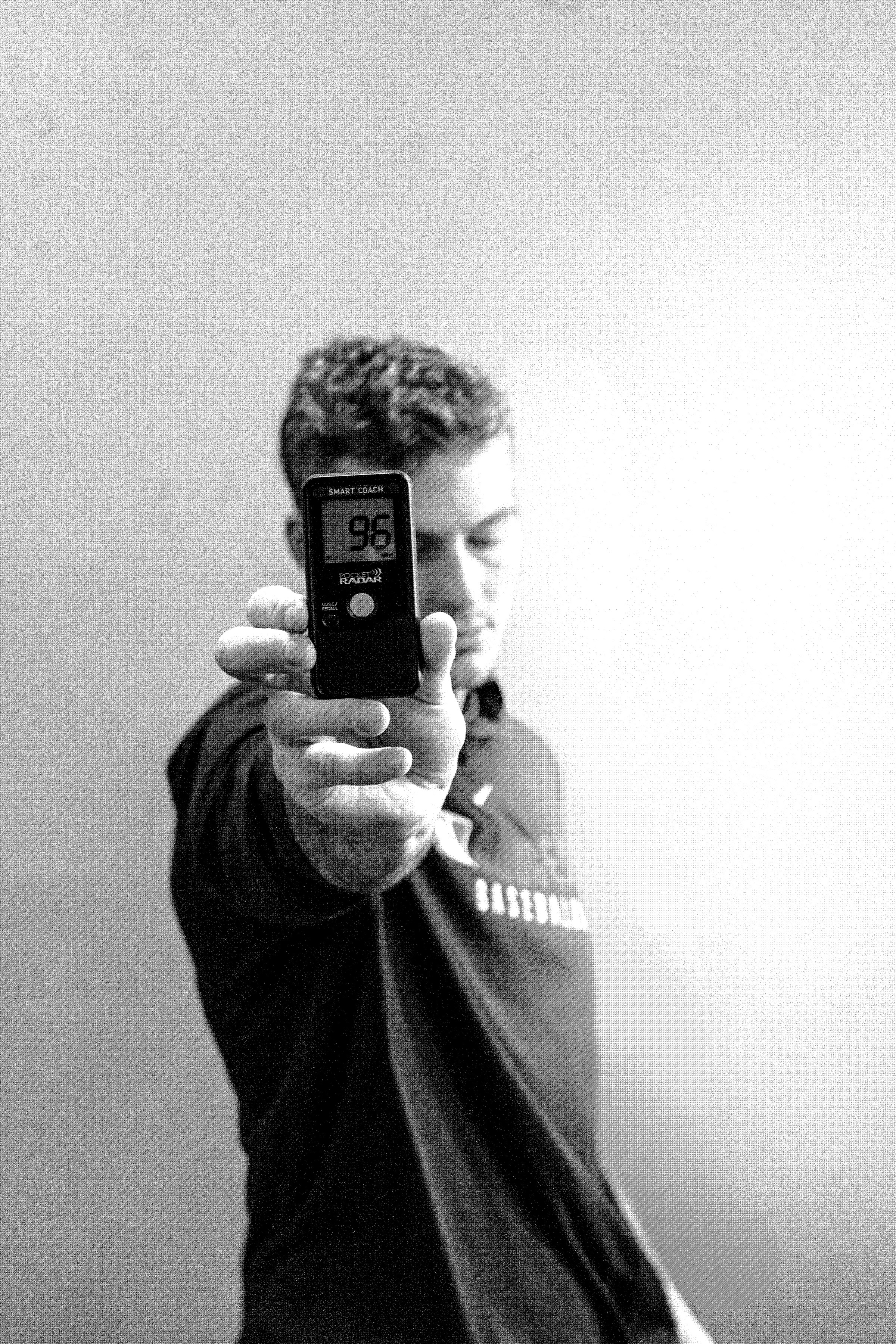 Rubicon coach holding up a Pocket Radar reading during training